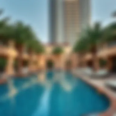 Luxurious swimming pool area surrounded by palm trees at Tower 5