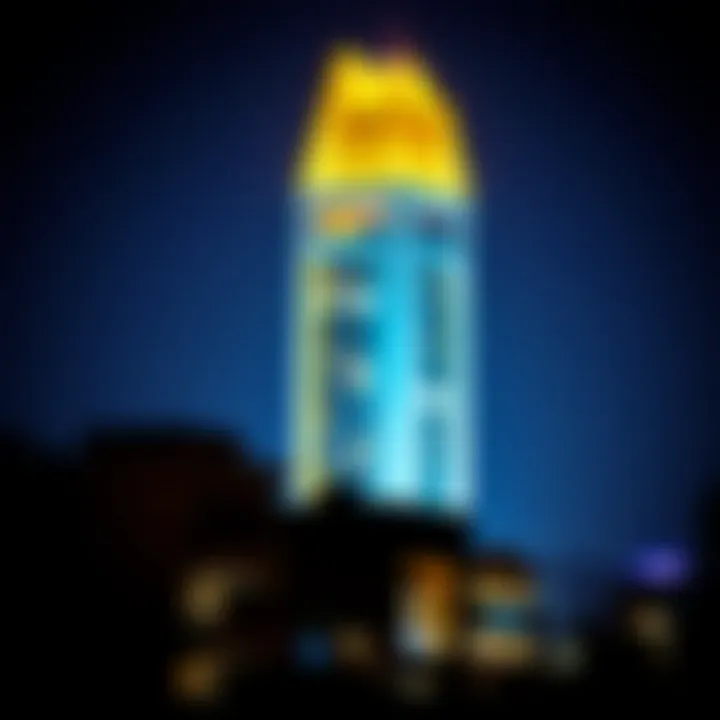 Night Illumination of Al Batha Tower Night view of Al Batha Tower illuminated, reflecting the vibrant urban life of Sharjah.