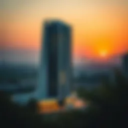 A stunning view of برج خولة الشارقة at sunset, showcasing its modern architectural design.